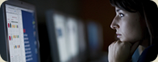 girl looking at a computer screen
